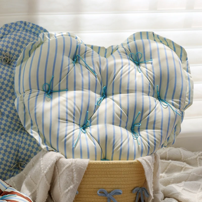 Heart-shaped padded floor cushion with checkered pattern and loop binding Stornfield