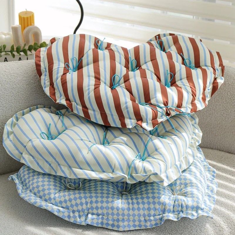Heart-shaped padded floor cushion with checkered pattern and loop binding Stornfield