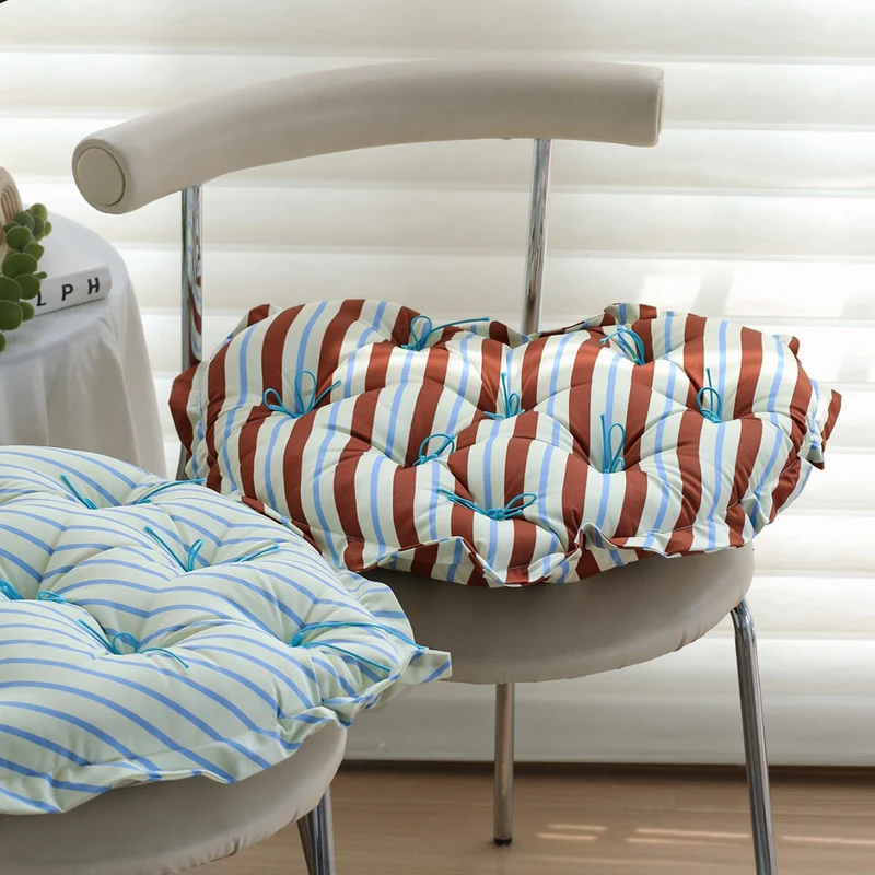 Heart-shaped padded floor cushion with checkered pattern and loop binding Stornfield
