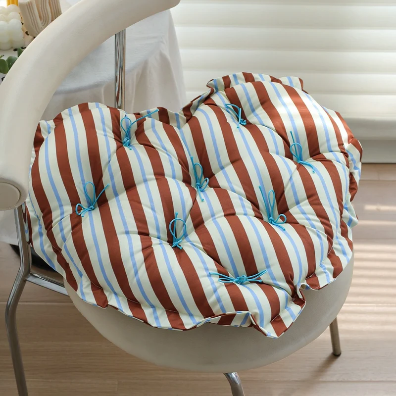 Heart-shaped floor cushion with quilted tufted upholstery and checkered satin cover Stornfield