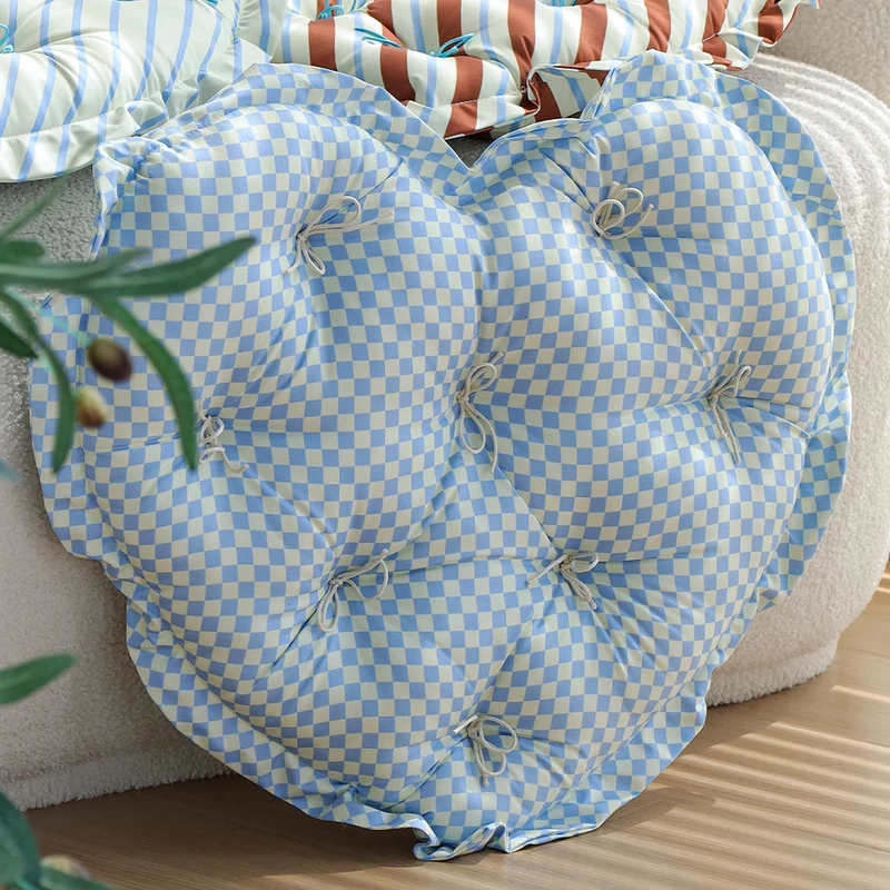 Heart-shaped floor cushion with quilted tufted upholstery and checkered satin cover Stornfield