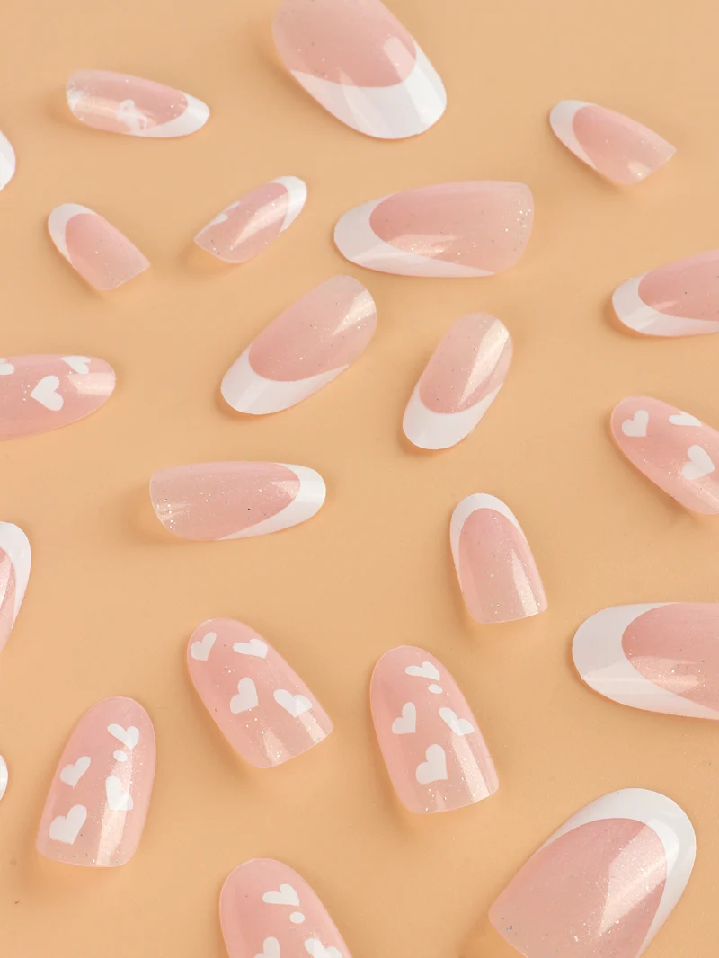 Heart-Patterned Acrylic Nail Art Extensions Stornfield