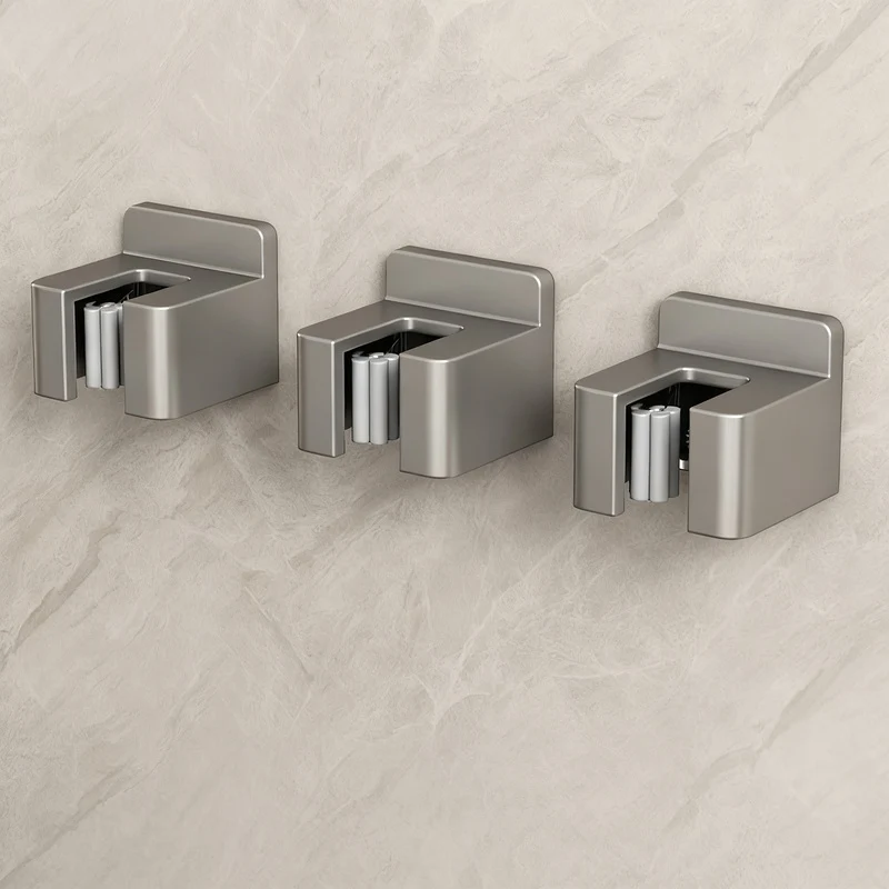 Stainless steel wall holder for brooms and mops