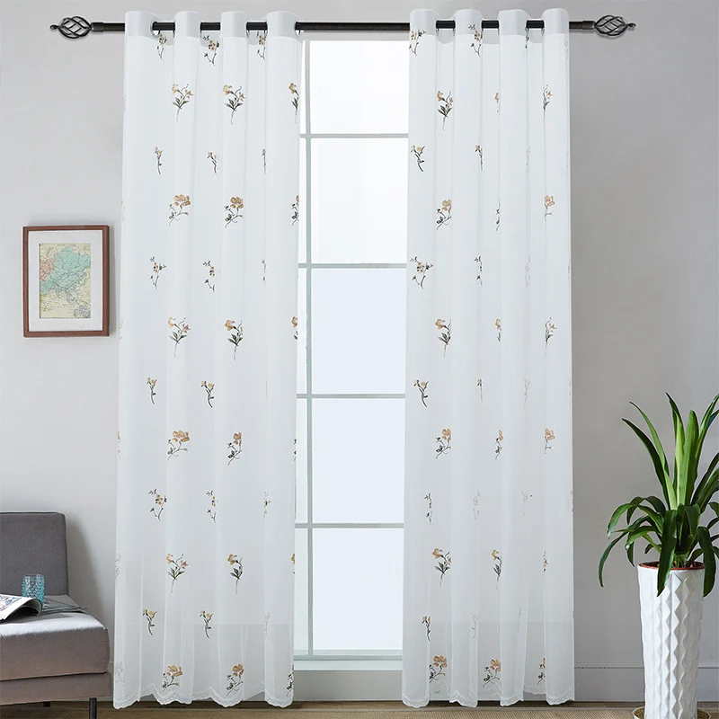 Embroidered sheer curtain panel made of fine tulle with floral embroidery relief and wavy hem Stornfield