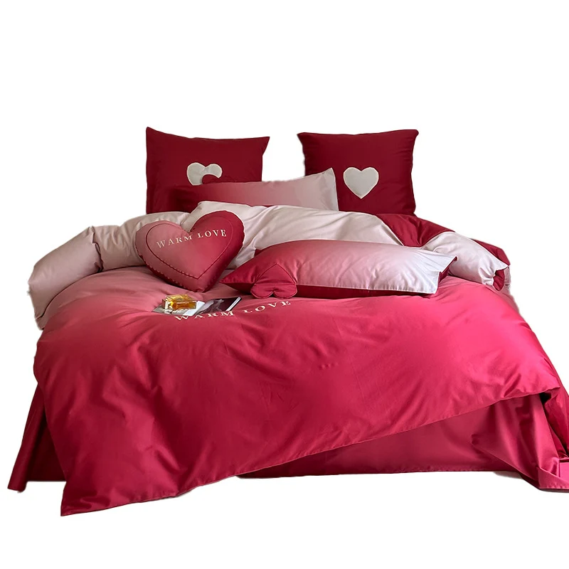 Reversible cotton satin bedding set with heart appliqué and embroidery motif Stornfield