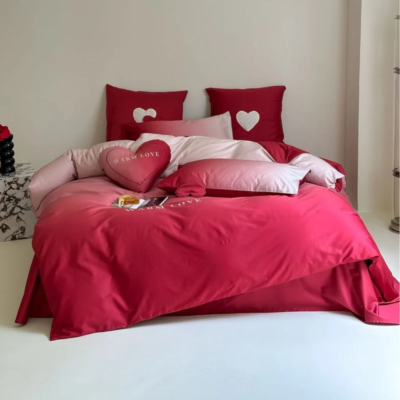 Reversible cotton satin bedding set with heart appliqué and embroidery motif Stornfield
