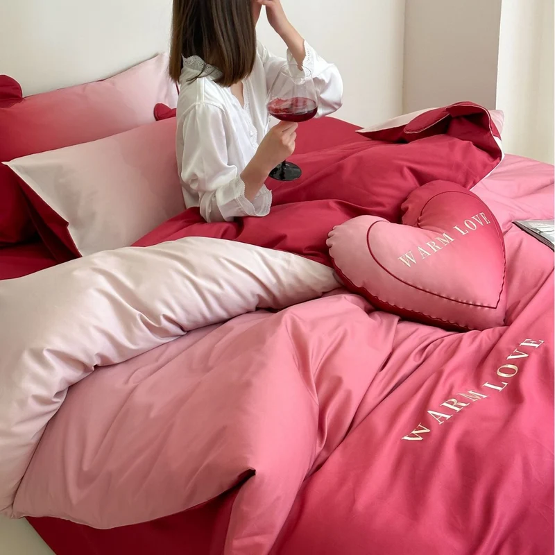 Reversible cotton satin bedding set with heart appliqué and embroidery motif Stornfield