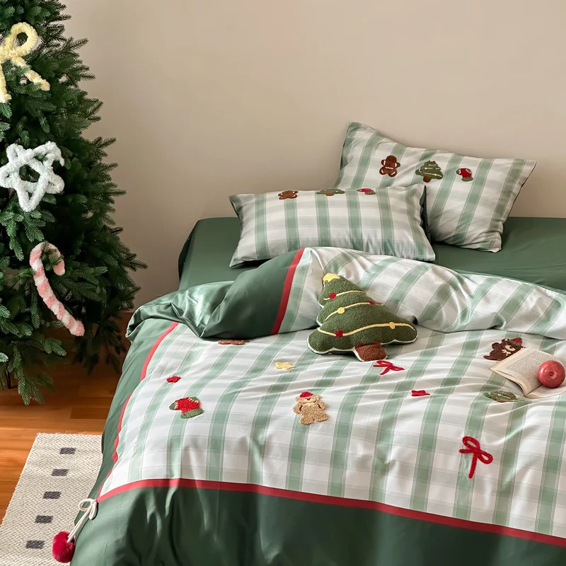 Christmas cotton satin bedding set with checked patchwork, embroidered applications and pompom details Stornfield