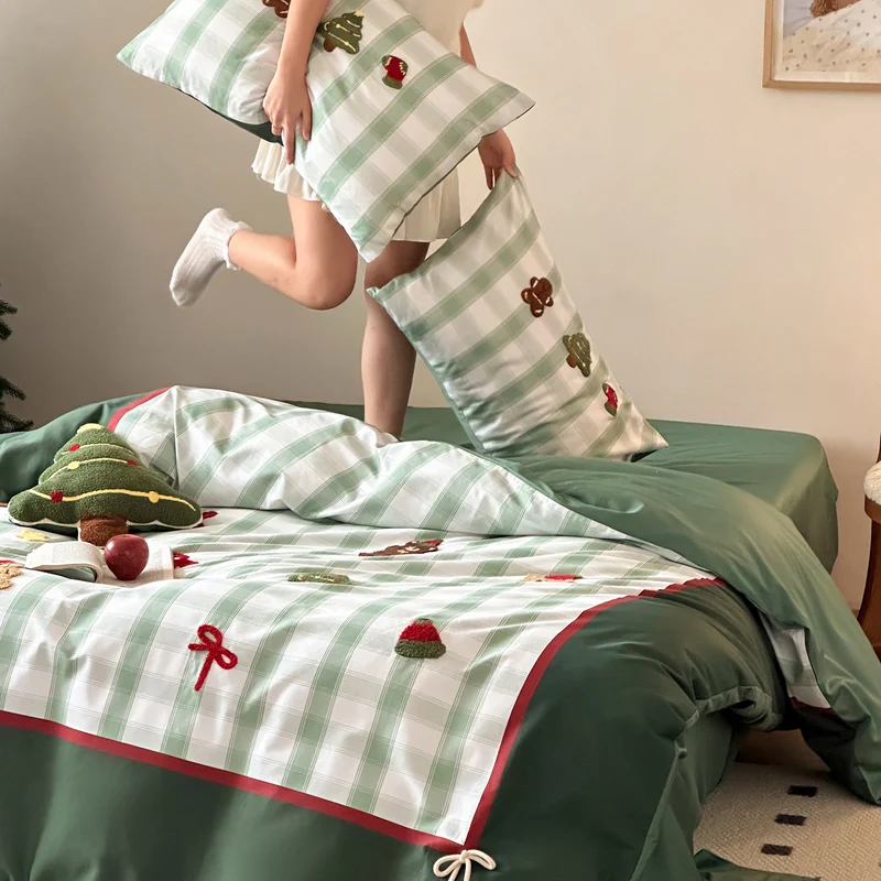 Christmas cotton satin bedding set with checked patchwork, embroidered applications and pompom details Stornfield