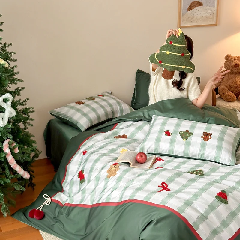 Christmas cotton satin bedding set with checked patchwork, embroidered applications and pompom details Stornfield