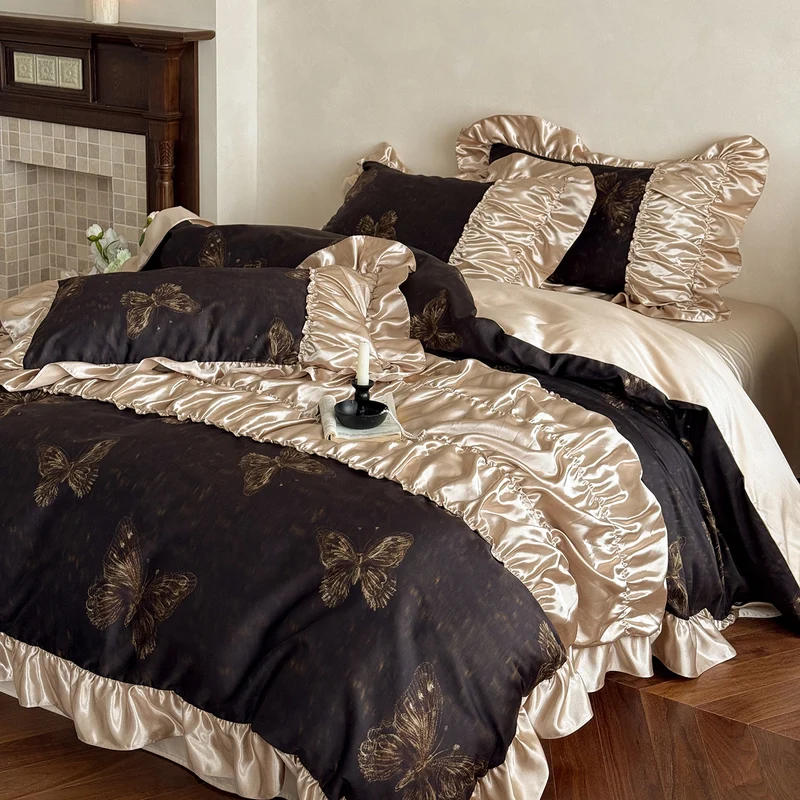 Silky shiny satin bedding set with butterfly pattern and voluminous ruffle frills Stornfield