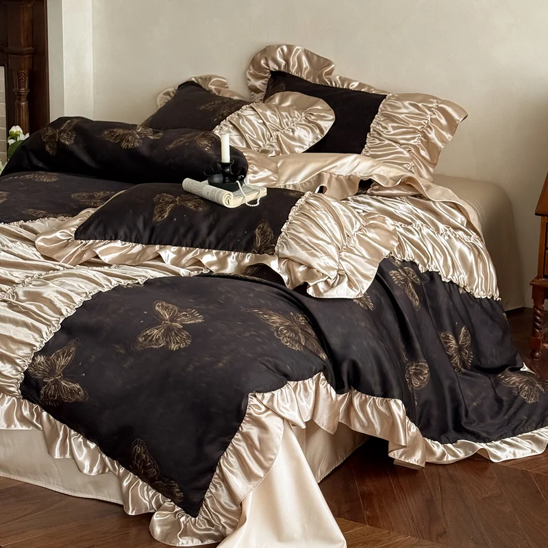 Silky shiny satin bedding set with butterfly pattern and voluminous ruffle frills Stornfield