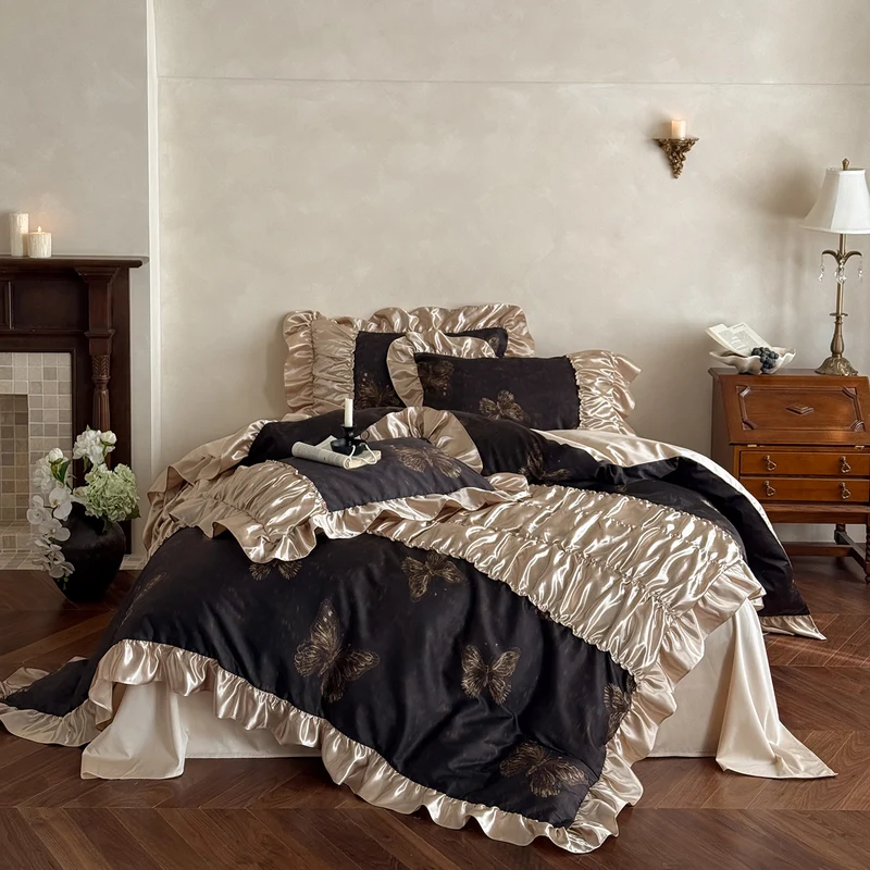 Silky shiny satin bedding set with butterfly pattern and voluminous ruffle frills Stornfield