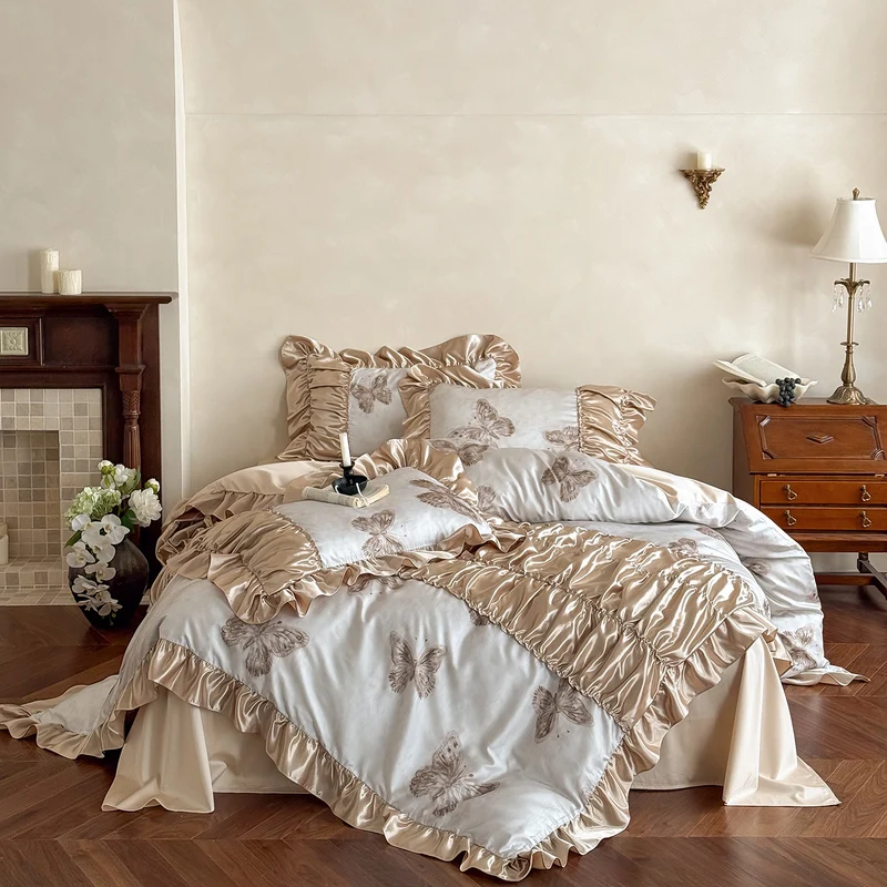 Silky shiny satin bedding set with butterfly pattern and voluminous ruffle frills Stornfield
