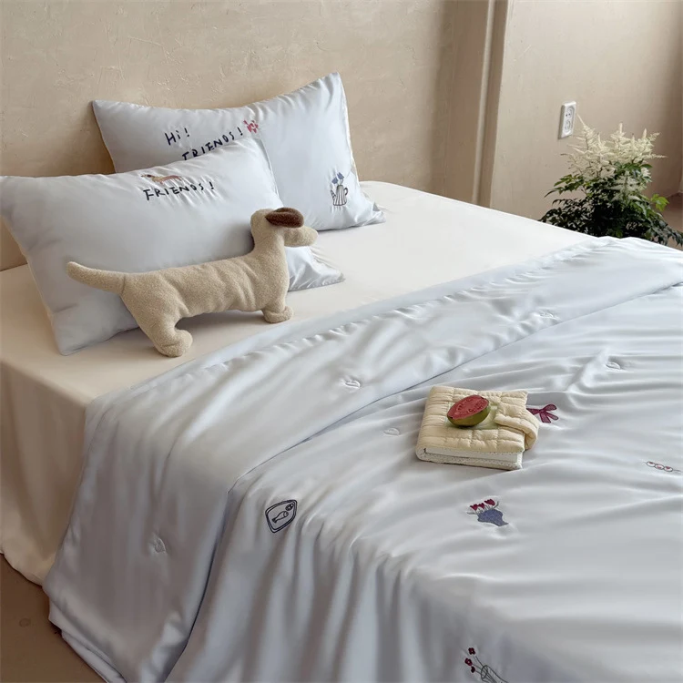 Silky-smooth satin bedding set with delicate embroidered icons Stornfield