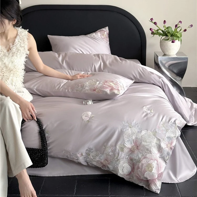 Satin bedding set with floral relief embroidery and velvety shine Stornfield