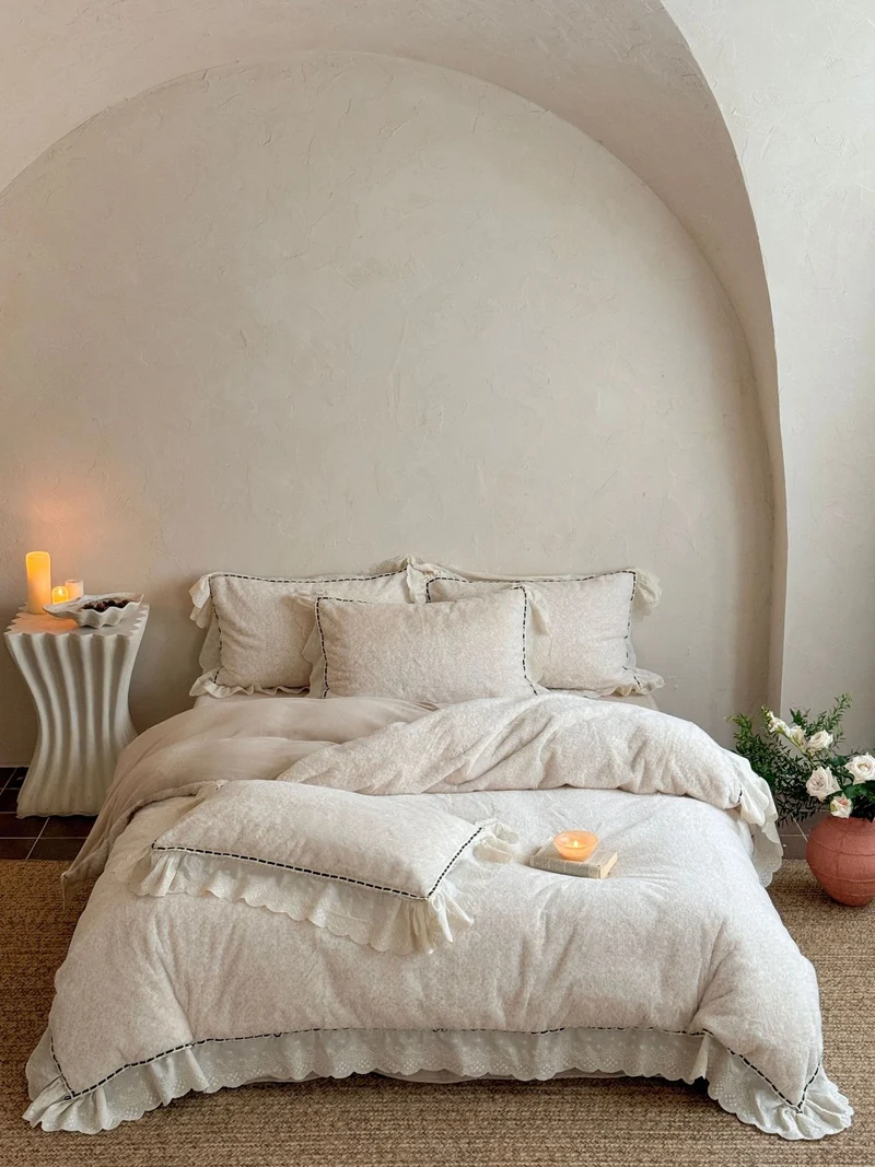Romantic bedding set with ruffles, lace and subtle flower pattern Stornfield