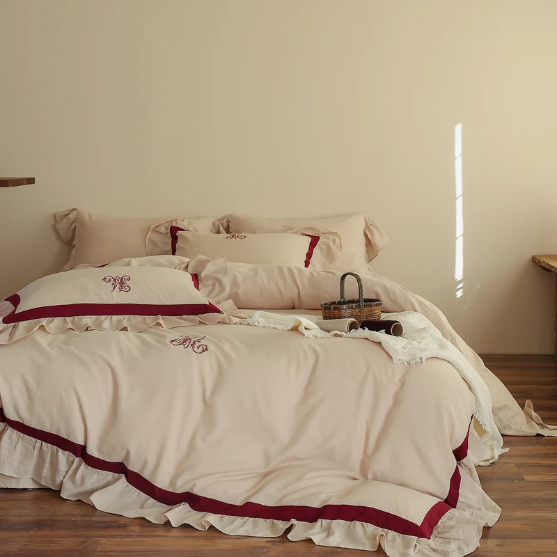 Romantic cotton-linen bedding set with ruffle, monogram embroidery, and contrasting trim Stornfield