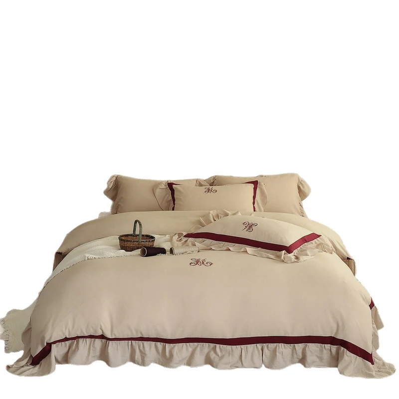 Romantic cotton-linen bedding set with ruffle, monogram embroidery, and contrasting trim Stornfield