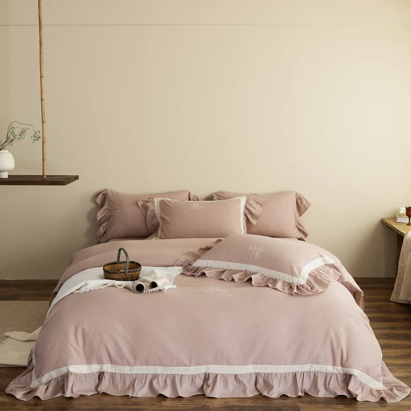 Romantic cotton-linen bedding set with ruffle, monogram embroidery, and contrasting trim Stornfield