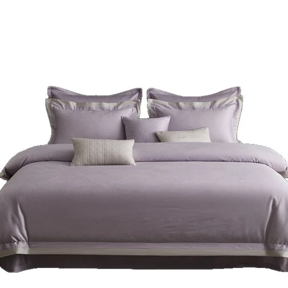 Premium duvet cover set with subtle jacquard structure and decorative ribbon Stornfield
