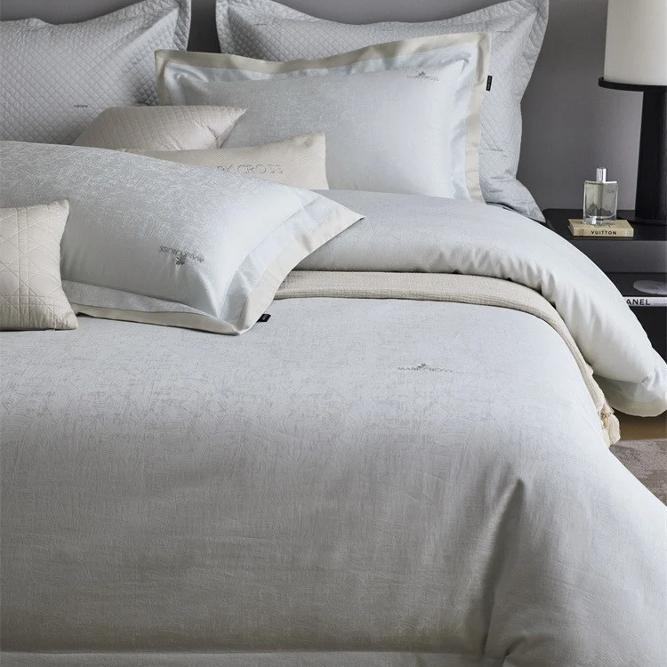 Premium duvet cover set with subtle jacquard structure and decorative ribbon Stornfield