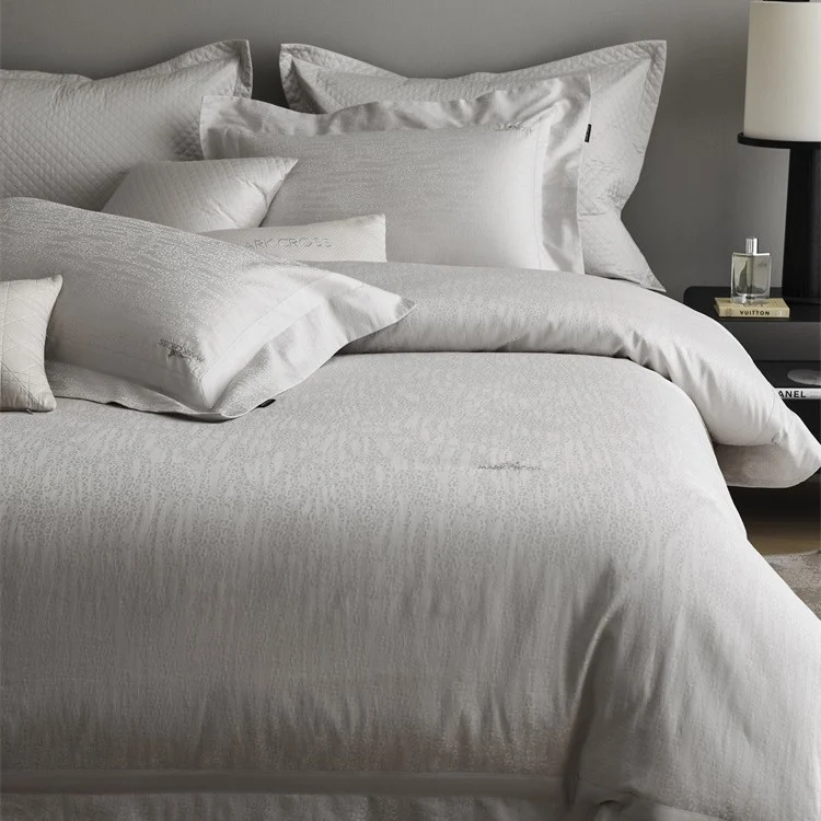 Premium duvet cover set with subtle jacquard structure and decorative ribbon Stornfield