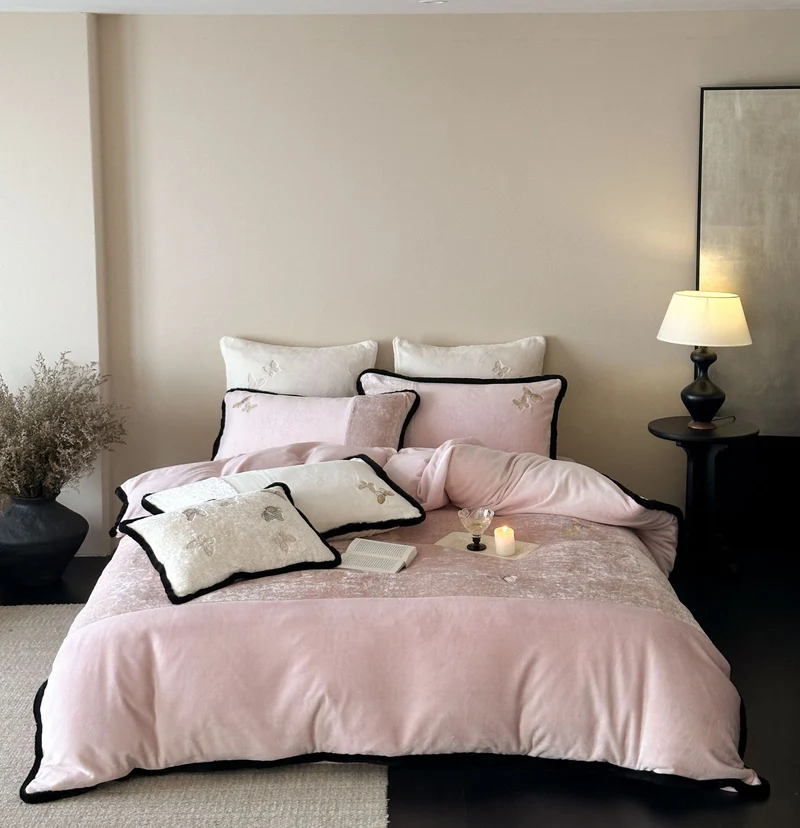 Premium cotton satin bedding set with embroidered butterfly appliqués and contrasting piping Stornfield