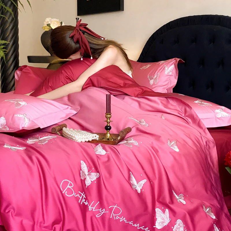 Luxury satin bedding set with embroidered butterfly appliqués Stornfield