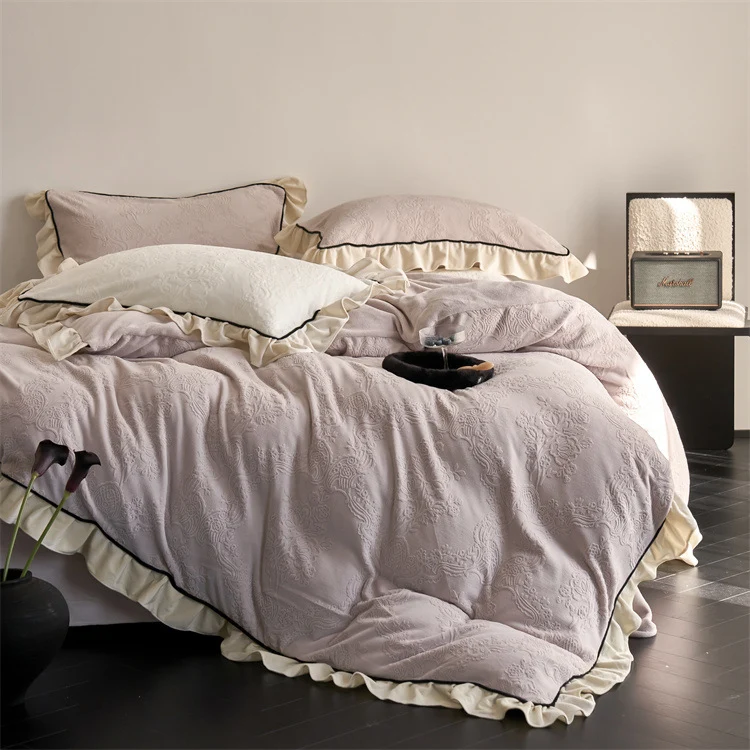 Jacquard bedding set with ruffle, fine floral embossing and contrasting piping Stornfield