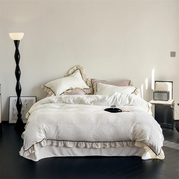 Jacquard bedding set with ruffle, fine floral embossing and contrasting piping Stornfield