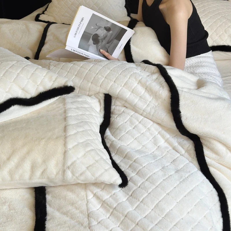 Quilted bedding and blanket set with contrast piping and velvety soft finish Stornfield