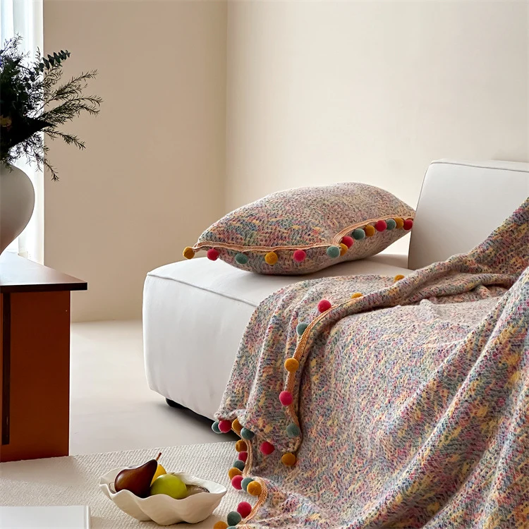 Extra soft cuddly throw blanket with pom-pom trim and mottled chenille relief Stornfield