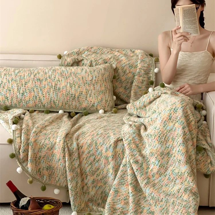 Extra soft cuddly throw blanket with pom-pom trim and mottled chenille relief Stornfield