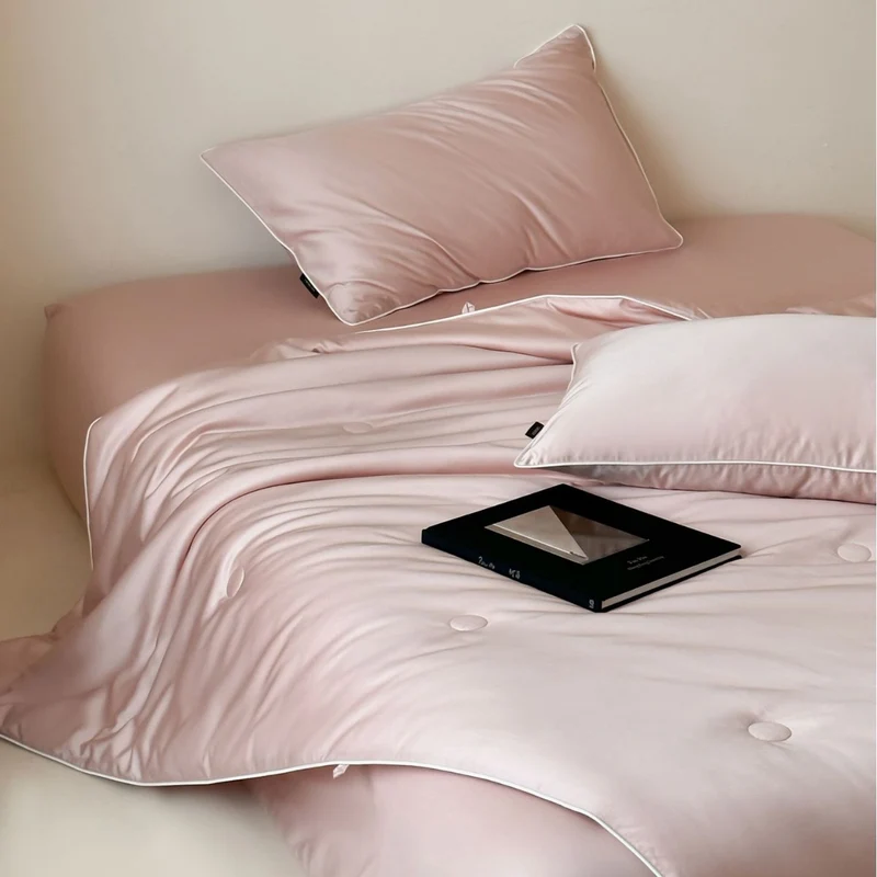 Elegant quilted satin bedspread set with piping and decorative buttons Stornfield