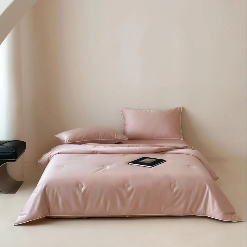 Elegant quilted satin bedspread set with piping and decorative buttons Stornfield