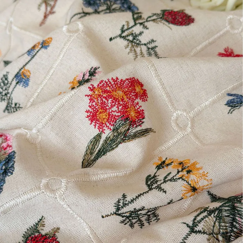 Boho bedding set with embroidered floral pattern and ruffled pillow Stornfield