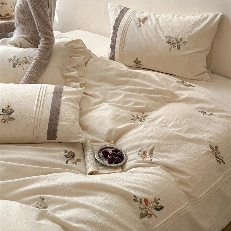 Luxurious embroidered cotton bedding set with ruffled pillow Stornfield