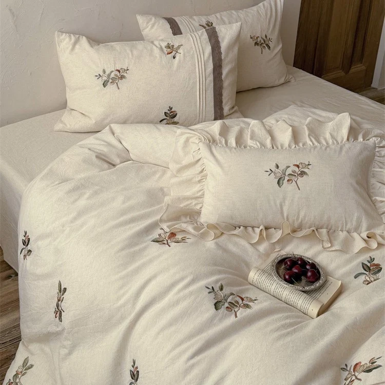 Luxurious embroidered cotton bedding set with ruffled pillow Stornfield