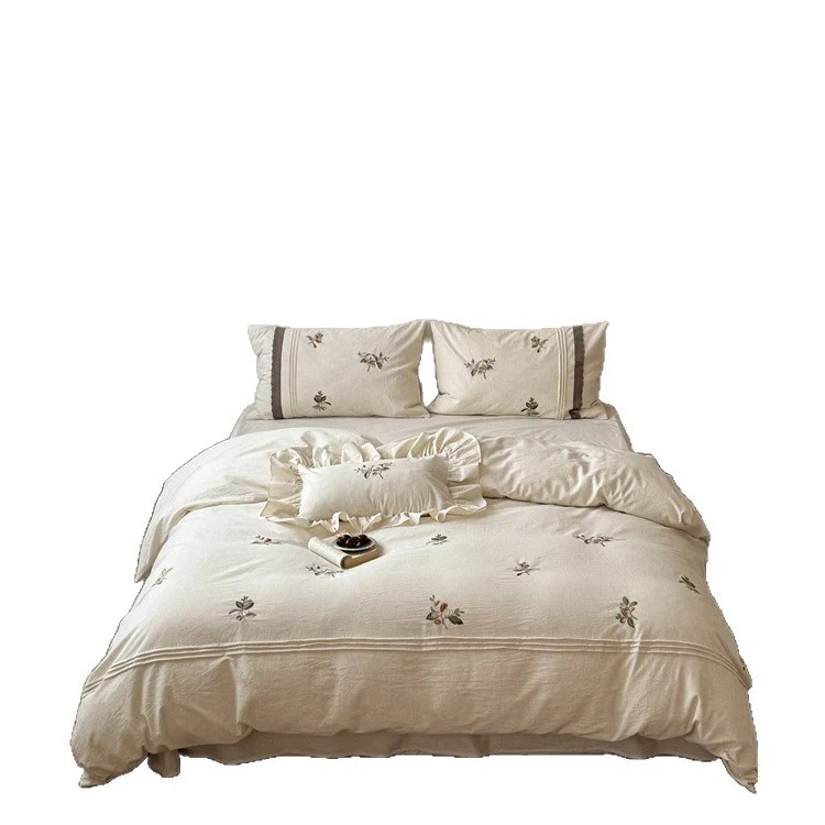 Luxurious embroidered cotton bedding set with ruffled pillow Stornfield