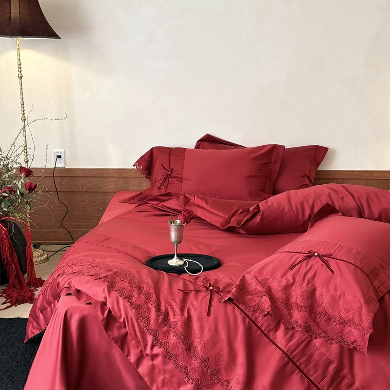 Luxurious bed linen set with lace edging, ruffles, and decorative bows Stornfield