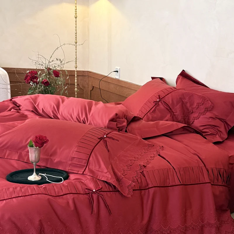 Luxurious bed linen set with lace edging, ruffles, and decorative bows Stornfield