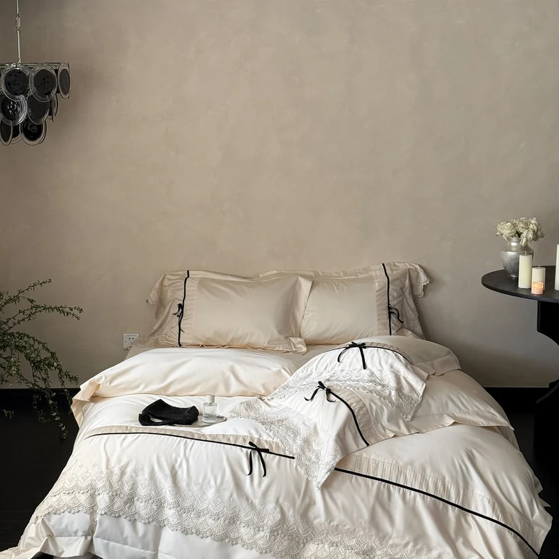 Luxurious bed linen set with lace edging, ruffles, and decorative bows Stornfield