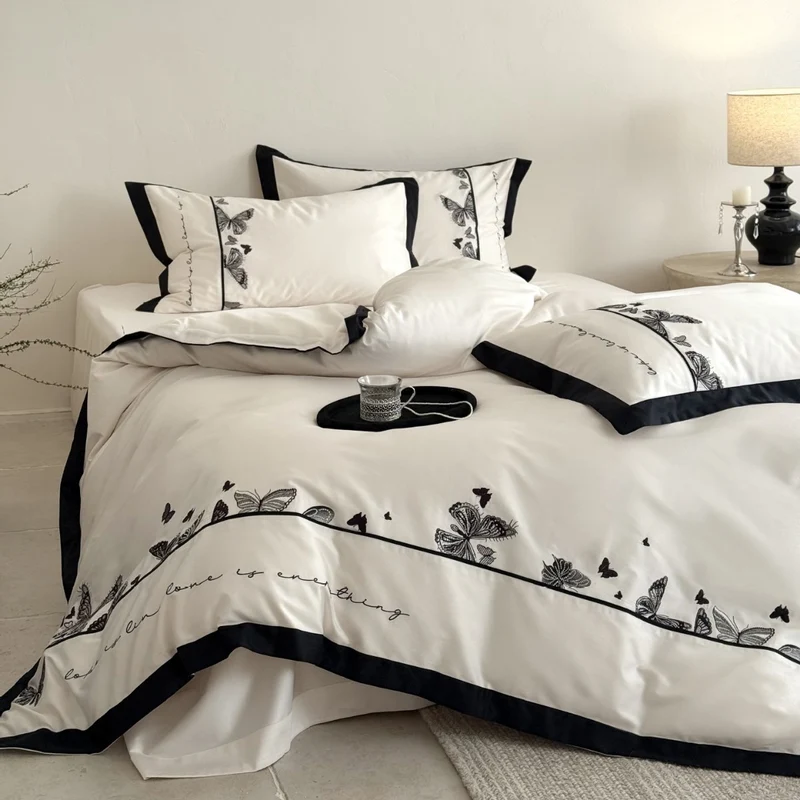 Luxurious cotton satin bedding set with butterfly embroidery and contrasting piping Stornfield
