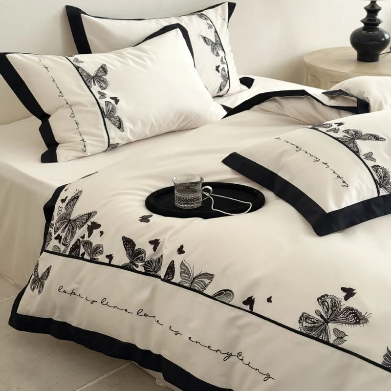 Luxurious cotton satin bedding set with butterfly embroidery and contrasting piping Stornfield