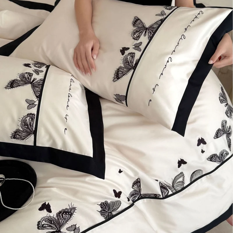 Luxurious cotton satin bedding set with butterfly embroidery and contrasting piping Stornfield