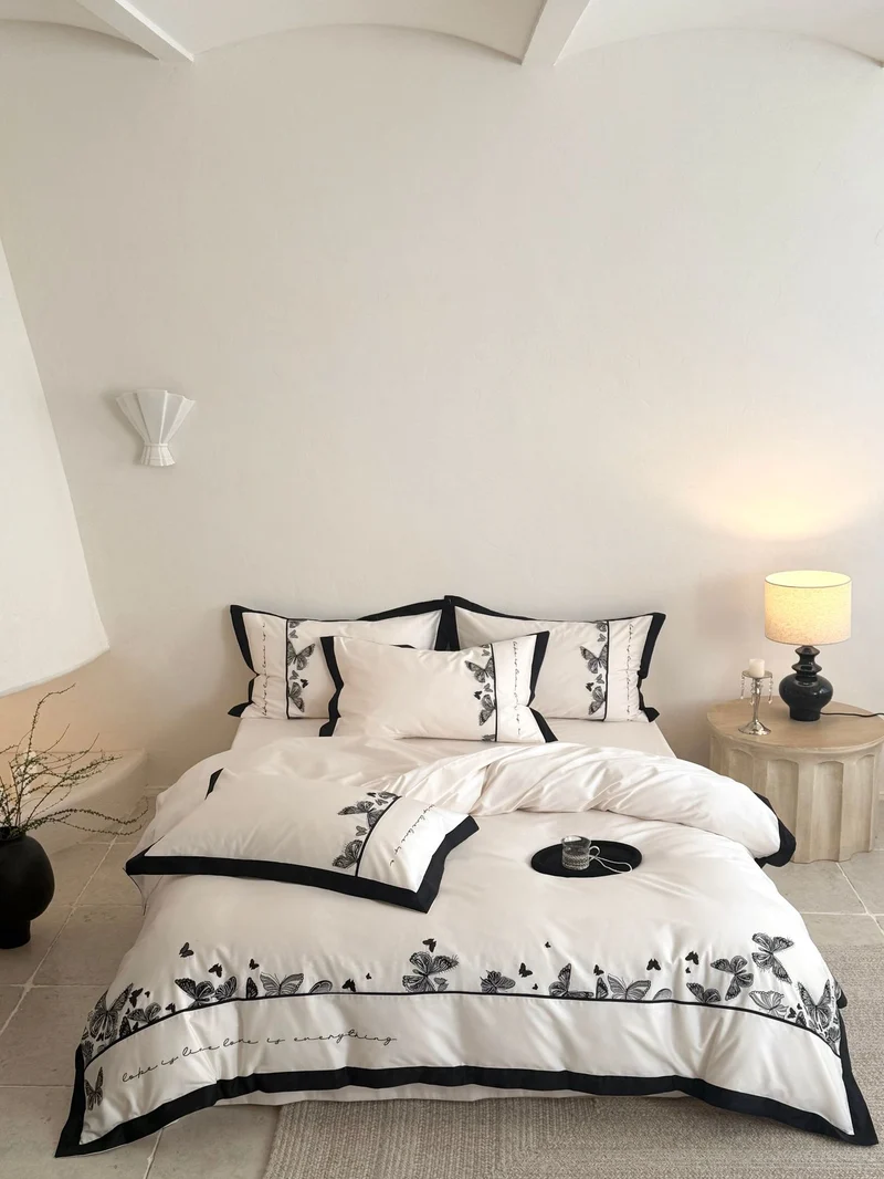 Luxurious cotton satin bedding set with butterfly embroidery and contrasting piping Stornfield