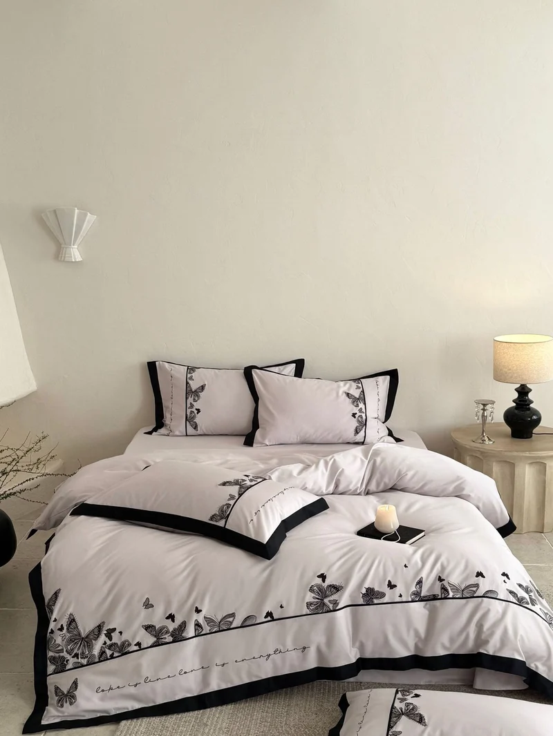 Luxurious cotton satin bedding set with butterfly embroidery and contrasting piping Stornfield