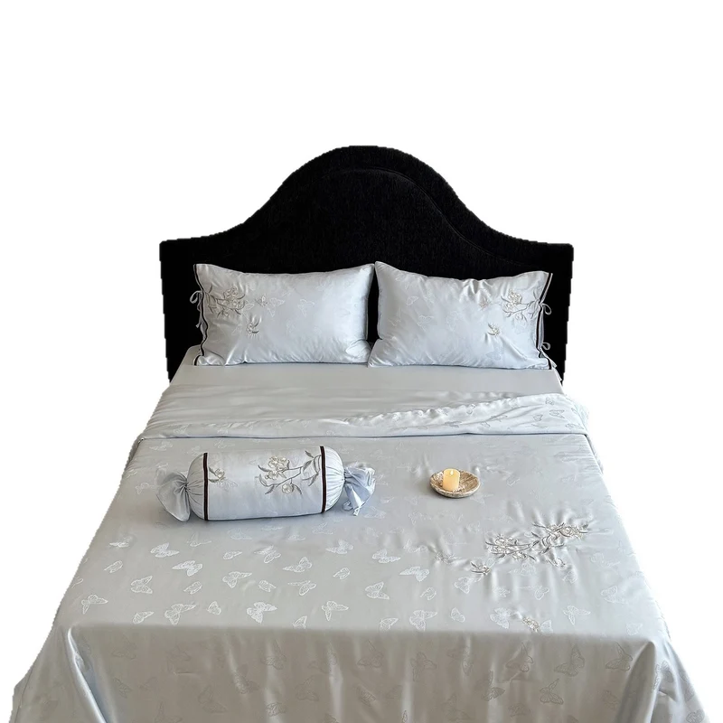 Light jacquard satin bed linen set with embroidered butterfly motif and decorative roll Stornfield
