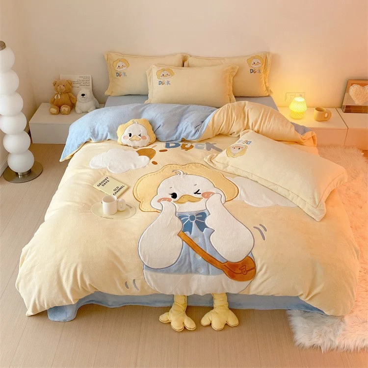 Cozy reversible bedding set with embroidered duck motif, appliqués, and Stornfield cuddle pillow